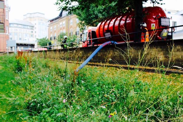A tanker of water is pumped into a swale in Hammersmith. Image: Groundwork